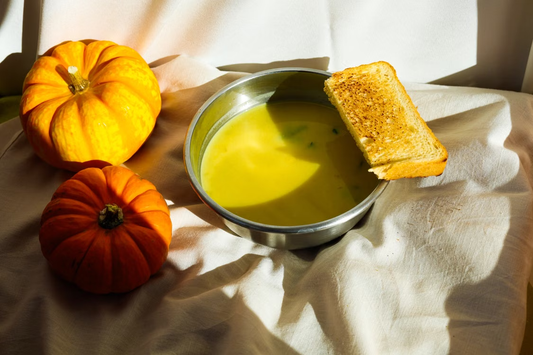 Autumn pumpkin soup served with grilled bread
