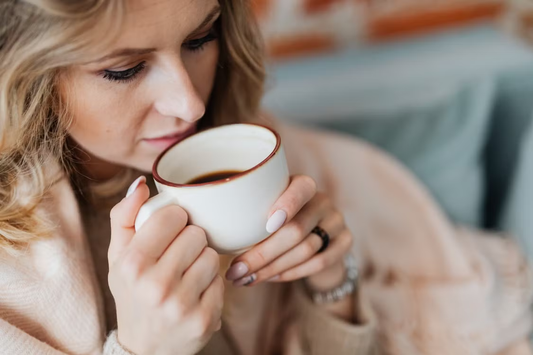 A woman drinking coffee